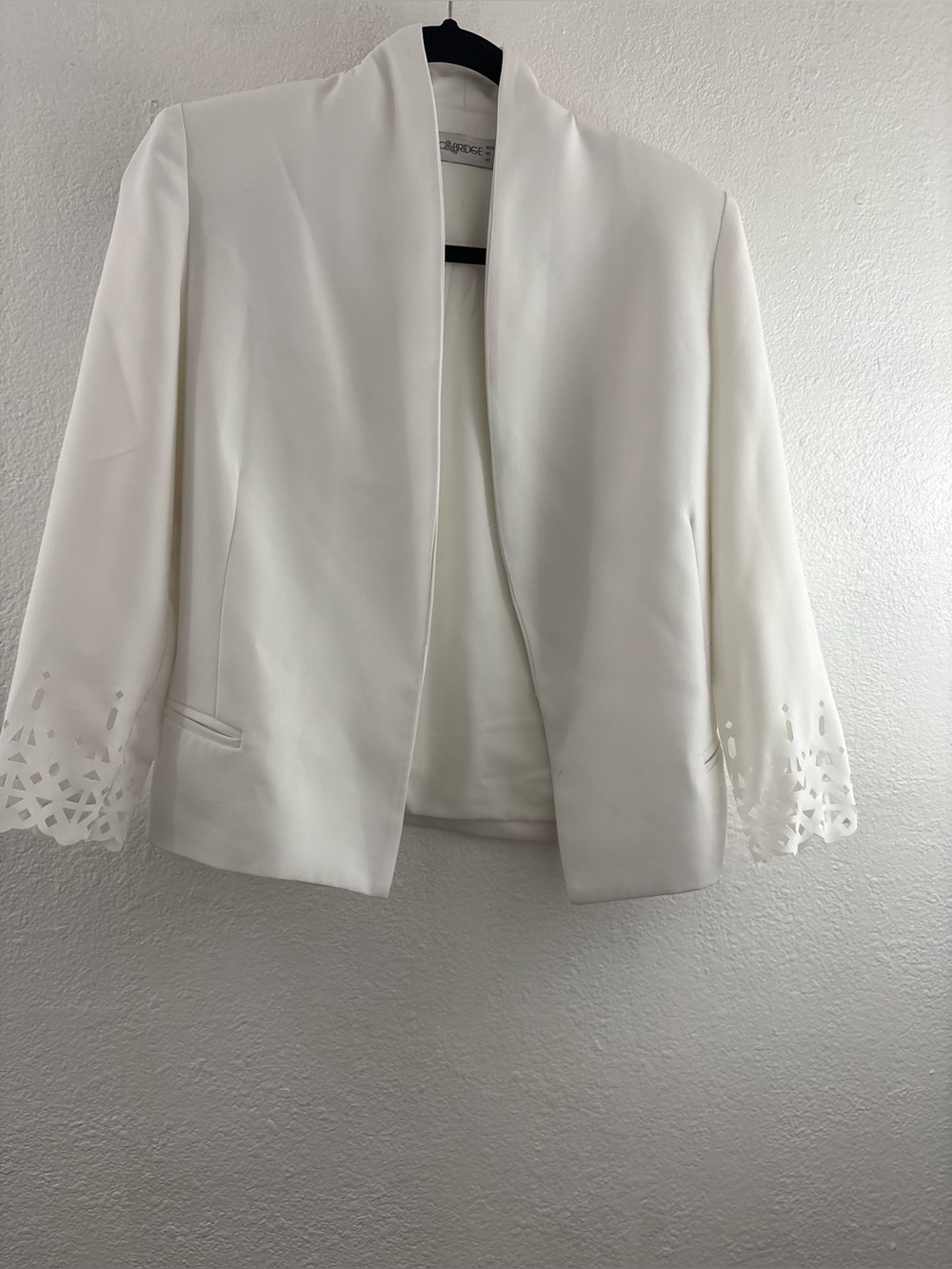 Bec & Bridge shawl-style collar and laser-cut geometric detailing on the cuffs 4